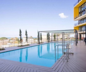 Luxury Beach Apartment with Pool & Gym By Airsuite